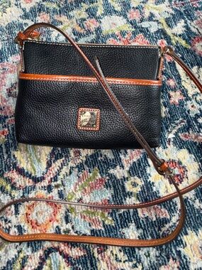 Dooney & Bourke Black Pebble Leather Crossbody with Brown Trim and Gold Logo